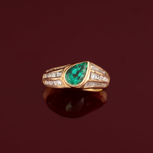 Pear emerald and diamond ring